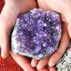 Purple Amethyst Crystal Geode in Hands